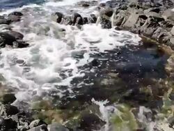 CU Shot of Tidal water at Giant's Causeway / Giant's Causeway, Northern Ireland, United Kingdom  Stock Footage