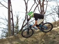 HD Super Slow-Mo: Biker Racing Along Trail Stock Footage