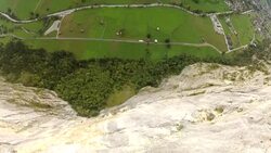 POV slow motion jumping off a cliff and falling down the rock face Stock Footage