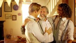 Groom hugging and talking with father and groomsman Stock Footage