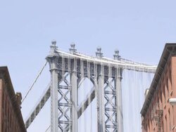 TD Manhattan Bridge to Dumbo street scene with Empire State Building in BG / Brooklyn, New York, USA Stock Footage