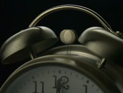 Alarm bell going off on clock, slow motion-close up Stock Footage