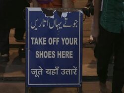 MH LD Sign Asking to Take Off Shoes / Jama Masjid Mosque, India Stock Footage