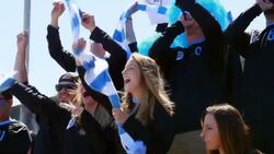 MS Group of soccer fans standing in crowd cheering during soccer match in stadium Stock Footage