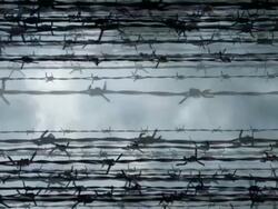 BARBED WIRE - cloudy background. slow expanding flow (loop) Stock Footage