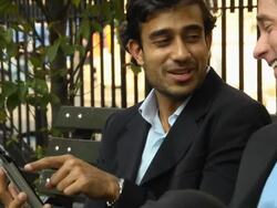 Businessmen Laugh at Digital Tablet Computer Stock Footage