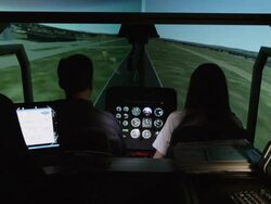 WS student pilots in helicopter flight simulator during take off from airport environment, RED R3D 4K Stock Footage
