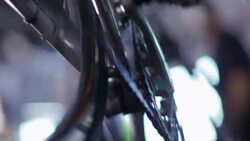 Bike mechanic cranks pedal by hand, inspects bicycle chain, and squeezes brake lever Stock Footage