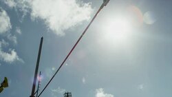 Female pole vaulter jumps and clears bar Stock Footage