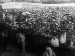 B/W 1960s high angle PAN crowd of Algerian nationalists cheering at rally / Algeria / educational Stock Footage