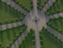 MS AERIAL ZO DS Shot of square with obelisk and residential villas in Putbus / Germany Stock Footage