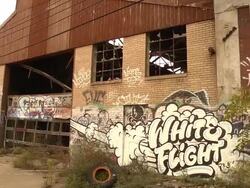 Pan of abandoned auto assembly plant Stock Footage