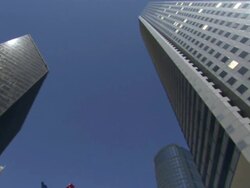 Low Angle pan-right - The JP Morgan Chase Tower and other Houston skyscrapers surround the Parsonage and Birds sculpture on the corner of Louisiana and Lamar. / Houston, Texas, USA Stock Footage