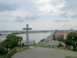 Budapest's stone cross on Gellert hill in front of the Danube Stock Footage