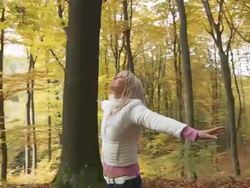 HD STEADY SHOT: Woman Throwing Leaves In The Air Stock Footage