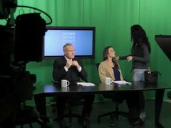 News presenters and make up artist in Television studio Stock Footage