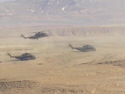 Aerial Military Helicopters landing in the Desert, Arava, Israel Stock Footage