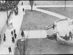 1921: RIOT: MS Article 'Topic of Day...Mob Rule', XHA TD PAN Courtyard to street w/ soldiers, WS Crowd of people 'mob' pushing beyond barriers & men in uniform trying to stop them, MS Soldier sitting w/ Browning machine gun, XHA TD People in street. Instructional Video