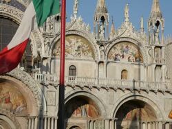MH LD Italian Flags Waving in front of Basilica San Marco / Venice, Italy Stock Footage