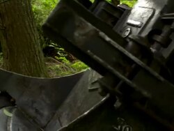 Quick pan left onto blade of saw on feller buncher. Stock Footage