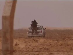 Pro-Gaddafi tank Burns in the Desert News Clip