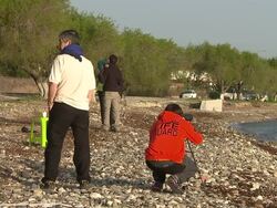 Volunteers and charity workers on a beach in Lesbos, where migrants often arrive after crossing from Turkey News Clip