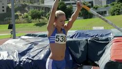 Female pole vaulter warming up Stock Footage