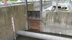 Flowing water at floodgate,Tilt Down Stock Footage