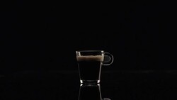 Crema (black coffee) in a glass Stock Footage