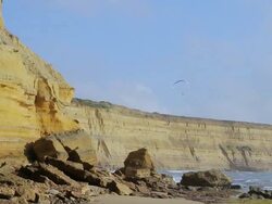 WS Para glider skimming stunning cliffs of surf coast at Jan Juc beach / Melbourne, Victoria, Australia Stock Footage