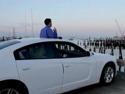 WS Man talking on bluetooth through sunroof of car / Portland, ME, United States Stock Footage