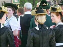 MS Pilgrimage of societies for traditional costumes at abbey Maria Eck near Siegsdorf, Chiemgauer Alps / Siegsdorf, Bavaria, Germany Stock Footage