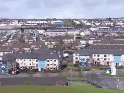 Houses in Derry from above, zoom in to wall art, from Magazine Street, Northern Ireland Stock Footage