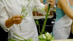 Florist arranging bouquet in flower shop Stock Footage