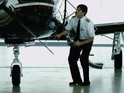 WS PAN MS Pilot checking private airplane in hangar / Spanish Fork, Utah, USA Stock Footage