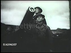 1942: FAIRBANKS, ALASKA: VS Rural area in Fairbanks w/ snow covered roads, house, & train. VS United States soldiers stationed, U.S. Navy battleship offshore, radio station w/ tent & power line, guard standing watch w/ mountains in BG. WWII, home fron Instructional Video
