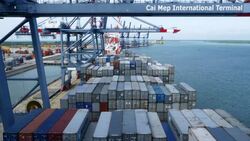 Shipping containers being loaded onto a container ship Stock Footage