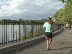 MS People running around Jacqueline Onassis reservoir in Central Park / New York, New York, United States Stock Footage