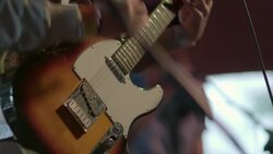 Musician plays electric guitar on stage with band in Austin bar Stock Footage