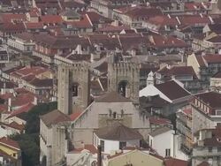 AERIAL WS Cityscape with Santa Maria Maior de Lisboa / Lisbon, Portugal Stock Footage