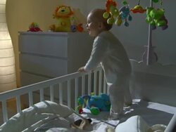 HD CRANE: Sleepless Baby Climbing Out Of Crib Stock Footage