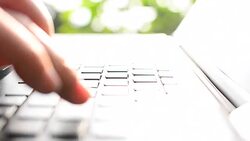 HD:Young woman typing on laptop keyboard Stock Footage