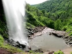 MS PAN Hikers and tourists enjoy swimming hole below Katterskill Falls / Haines Falls, New York, United States Stock Footage