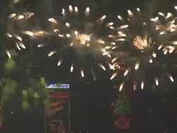 Fireworks explode with large skyscrapers in the background, East Asian Games Opening Ceremony Fireworks Display, December 2009 Stock Footage