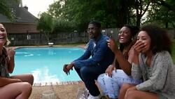 MS Smiling group of friends hanging out by backyard pool on summer evening Stock Footage