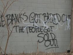 Social commentary graffiti tarnishes buildings Stock Footage