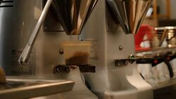 Automated coffee grinder filling container Stock Footage