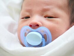cute asian baby with pacifier Stock Footage