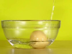 Pouring hot water for boiled egg Stock Footage