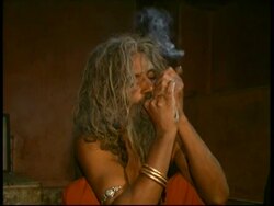 CU monk smoking in dark room, Rajasthan, India Stock Footage